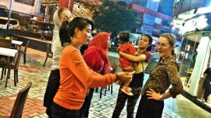 Making a public spectacle on a Tuesday night. Soetry is in orange, Novi and her daughter are behind me, and Ibu Evi is taking the photo.