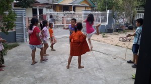 These are the kids of our immediate neighbors. Last week they wanted to hang out with us outside of our Thursday night English club, so we invited them in to play games in our yard. They played jump rope and a game like rock-paper-scissors, and we introduced them to the Limbo. They are our friends and, in a way, our protectors because they are always watching our house and accompanying us around the neighborhood. Their smiling faces and exuberant reception have made me feel welcome here. 
