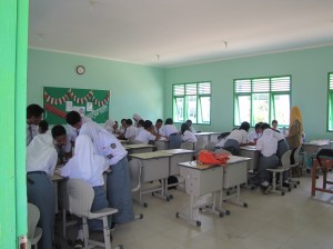 Some of my students working in small groups to unscramble a letter that I wrote. Lessons that require nothing more than paper, pen, and maybe a dry erase board are my preferred style of teaching in this country of uncertainty.
