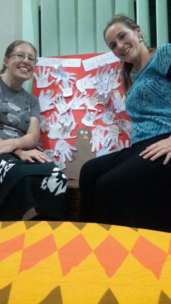 Me and Caitlin after English club with the "I am thankful for..." turkey made out of the hands of our kids. This decoration (along with the Halloween tinsel that is still on the front door) will probably stay up until we leave. 