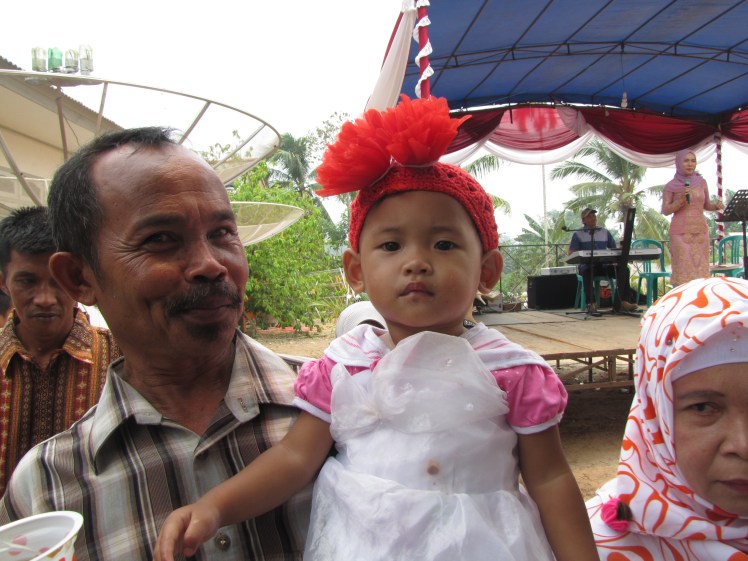 But I also get pictures of Indonesians too, like this cutie and her proud papa.