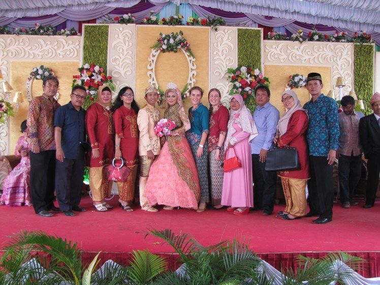 There is a break in the handshakers, and we make a break for it! The couple is in the center, with Caitlin and I and fellow teachers from SMK 2 (Caitlin's school) flanking out the sides.