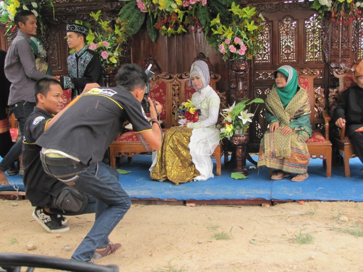 The second wedding wasn't nearly as large as the first, and the bride and groom were far younger. Apparently the groom is an alumn of SMK2, though he looks so young that I wonder if he is actually still a student. Both he and his new bride are 19. The norm in Bangka is to be wed at 21/22 for ladies and 24/25 for gents, so even the teachers we were with agreed that they were a little young. Still, we wish them all the best.