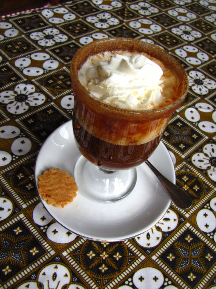 Cafe Batavia was pretty expensive, so we each got a coffee and ate at a street stall we saw on the way. This coffee was decadent and oh so delicious, with caramelized sugar on the rim of the glass, homemade whipped cream, and a splash of the hair of the dog that bit me. There's no way I would find something like this at my site, which is why I paid what Rebecca pointed out was almost a third of the cost of my flight home. When in Rome, right?