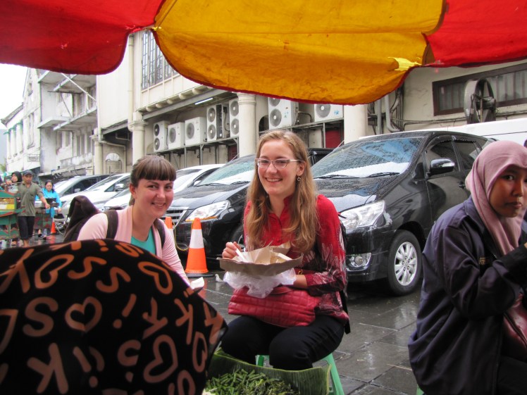 Rebecca and I chowing down at the street stall outside of the cafe. I was jammed with people when we first passed by, which is why ate there. We are eating kwitieow (thick noodles that are my favorite) with strips of fried tofu and some five-star peanut sauce.
