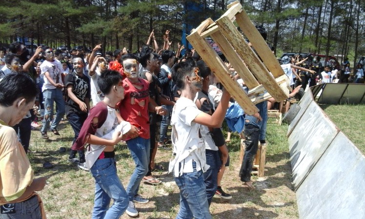 As if a Zombie Run wasn't enough, the festivities continued with a Zombie Rave... at 10 in the morning. The zombies all came out to take a bow and then the DJ started playing some music that reminds me of what I danced to at Bonnaroo until the sun came up. And boy did we dance! Me, zombies, my running buddies, and even a few students from my school (my classes too!) were there to get wild and crazy with some zombies. I hope they (my students) can still take me seriously at school after seeing their teacher covered in mud and shimmeying around with some zombies.