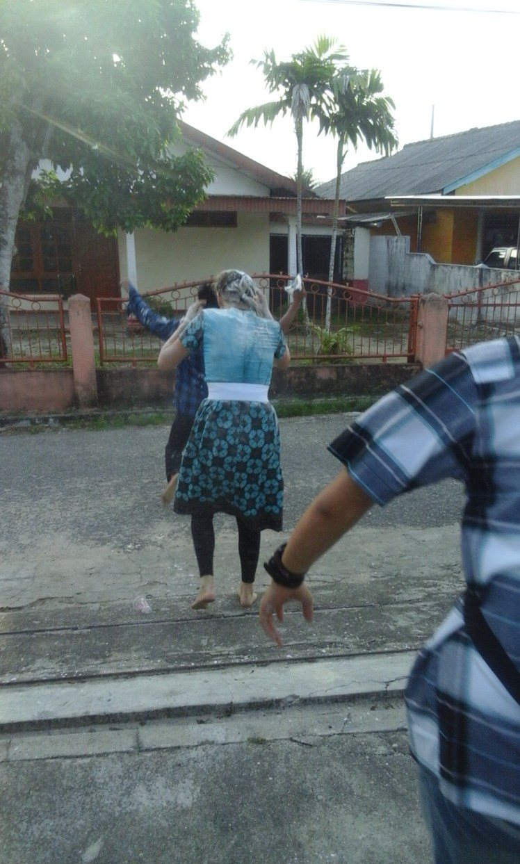 Waldy still holding the evidence as I chased him down