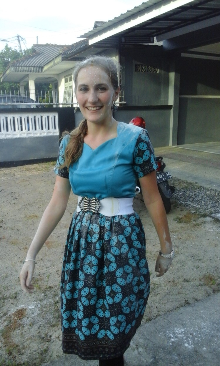 In Indonesia, it is tradition to break eggs and throw flour on the head of the birthday person. Apparently, it is also customary to tie the person down before attempting to turn them into cake batter. Caitlin warned me that this would happen, which I accepted as long as I didn't know it was coming. So when the "Handsome Boys" (the name a group of my students gave themselves in their birthday card to me) said that they had another surprise for me, I followed them outside. For some reason I thought they had firecrackers, but when Caitlin took my phone out of my belt I knew what was coming....