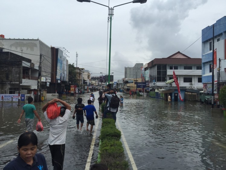 At the edge of the floodwater in downtown. Caitlin and I decided to wade into it and see our poor city underwater.