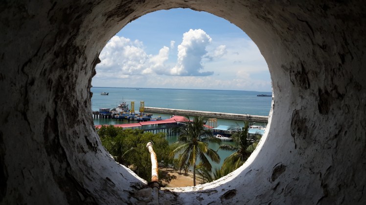 The ship skeletons above are located directly below Mentok's lighthouse. With permission of the locals, Dian and I were able to climb to the top. My legs are still sore, but the view was great.