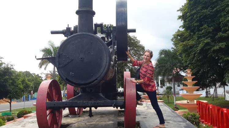 Once upon a time there was a train on Bangka, presumably to cart aforementioned tin to the ports. This train stands as a relic. Its parts still move, hence my surprised smile.