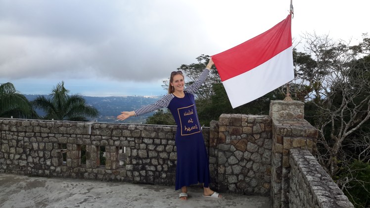 Another view, this time posing with the merah-putih (red and white, Indonesia's flag).