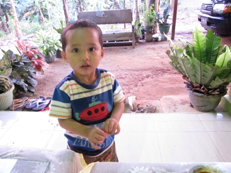 At the arisan party this little buddy ate until he literally got sick on a rug. Afterward he seemed to think it was pretty funny.